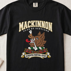 MacKinnon graphic T-shirt in Black, front flat lay showing varsity lettering and brown boar head with white tusks, red tongue and a white bone.