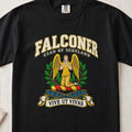 Falconer Scottish clan T-shirt in Black, front view with a kneeling gold-winged figure surrounded by green branches and motto banner.