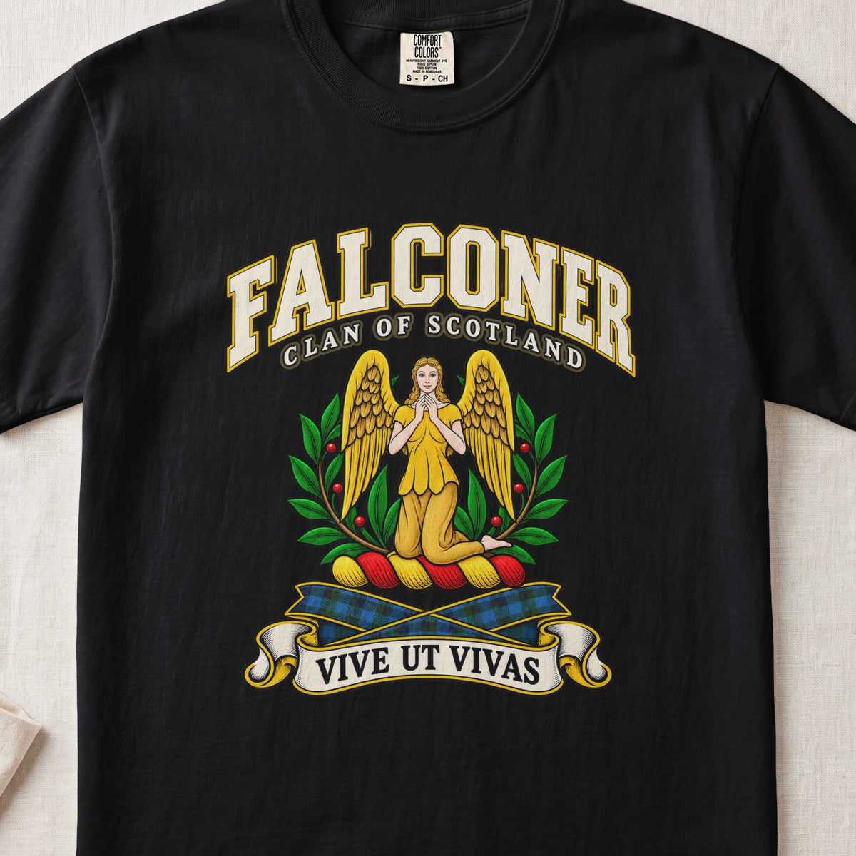 Falconer Scottish clan T-shirt in Black, front view with a kneeling gold-winged figure surrounded by green branches and motto banner.