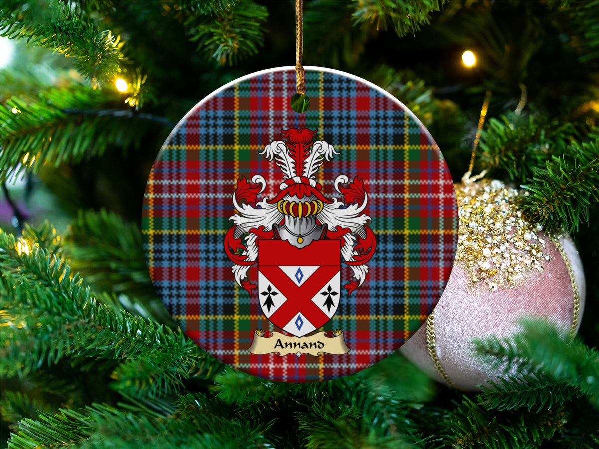 Annand Scottish clan ceramic ornament with family crest on a Caledonia tartan background, hanging on a Christmas tree