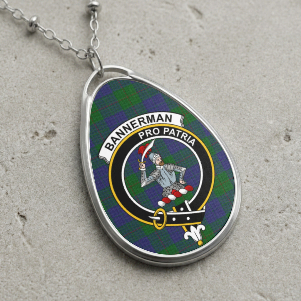 Bannerman clan Scottish tartan necklace with clan crest and Pro Patria motto on tartan background