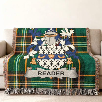 Green tartan throw blanket with family crest and "READER" banner.