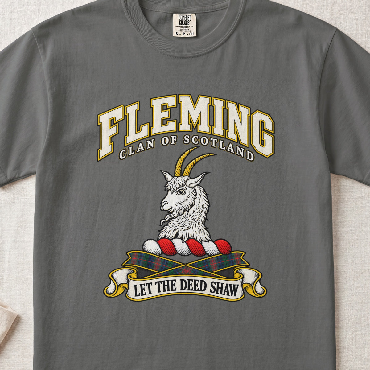 Fleming Scottish clan T-shirt in Pepper, front view with a silver goat head with golden horns and motto banner.