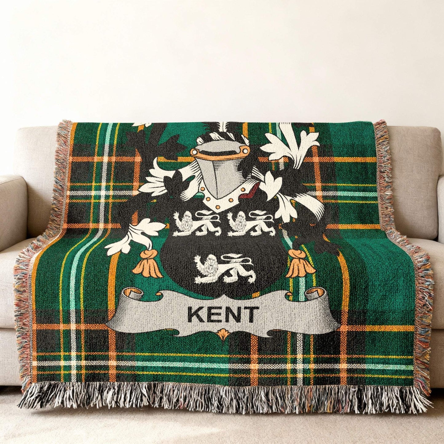 Green plaid blanket with a crest bearing the name "Kent".