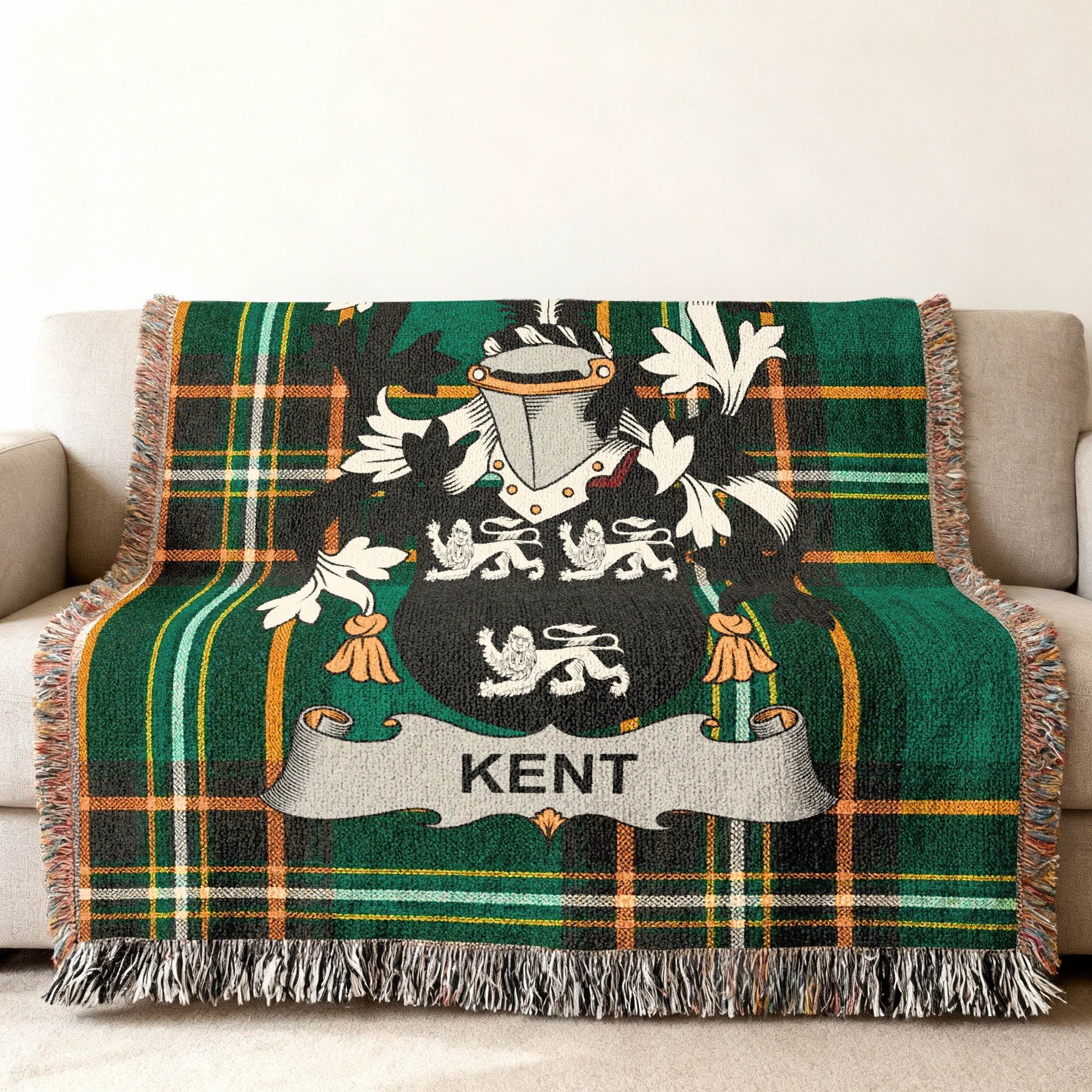 Green plaid blanket with a crest bearing the name "Kent".