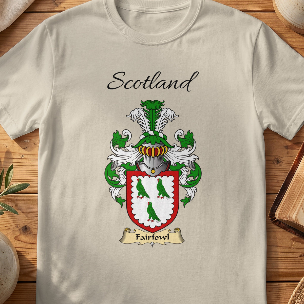 Sand Fairfowl Scottish family shield T-shirt featuring three green birds within a red border
