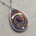 Silver chain necklace with oval pendant featuring Mackie clan crest on tartan.