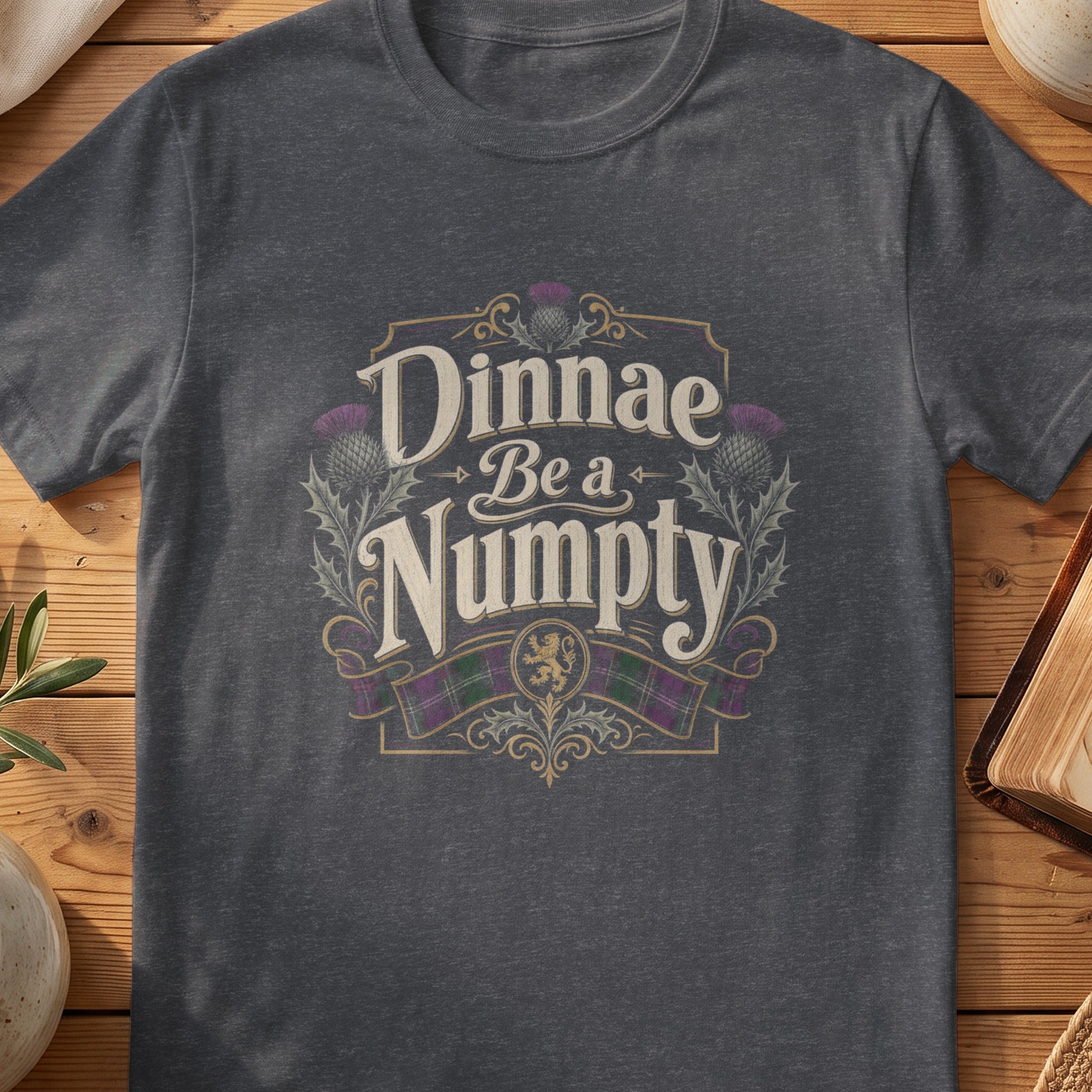 Dark grey Gildan 64000 unisex T-shirt flatlay with Dinnae Be a Numpty Scottish graphic design