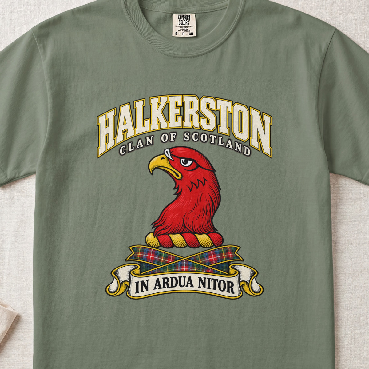 Halkerston Scottish clan T-shirt in Moss, front view with a red bird head with a golden beak and motto banner.