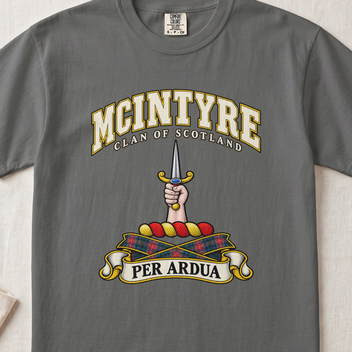 McIntyre Scottish clan T-shirt in Pepper, front view with a hand holding an upright dagger and motto banner.