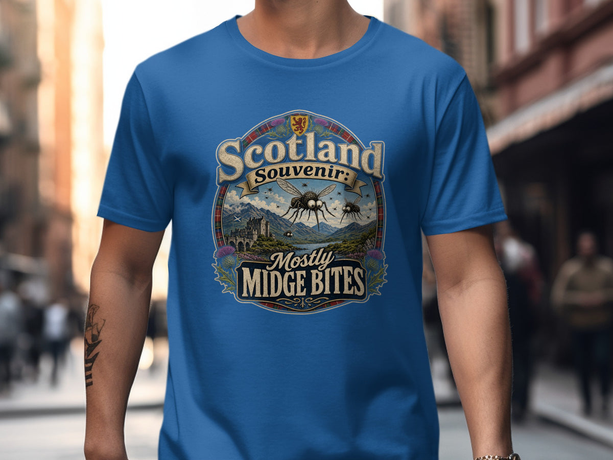 Blue t-shirt with "Scotland Souvenir: Mostly Midge Bites" graphic featuring midges.