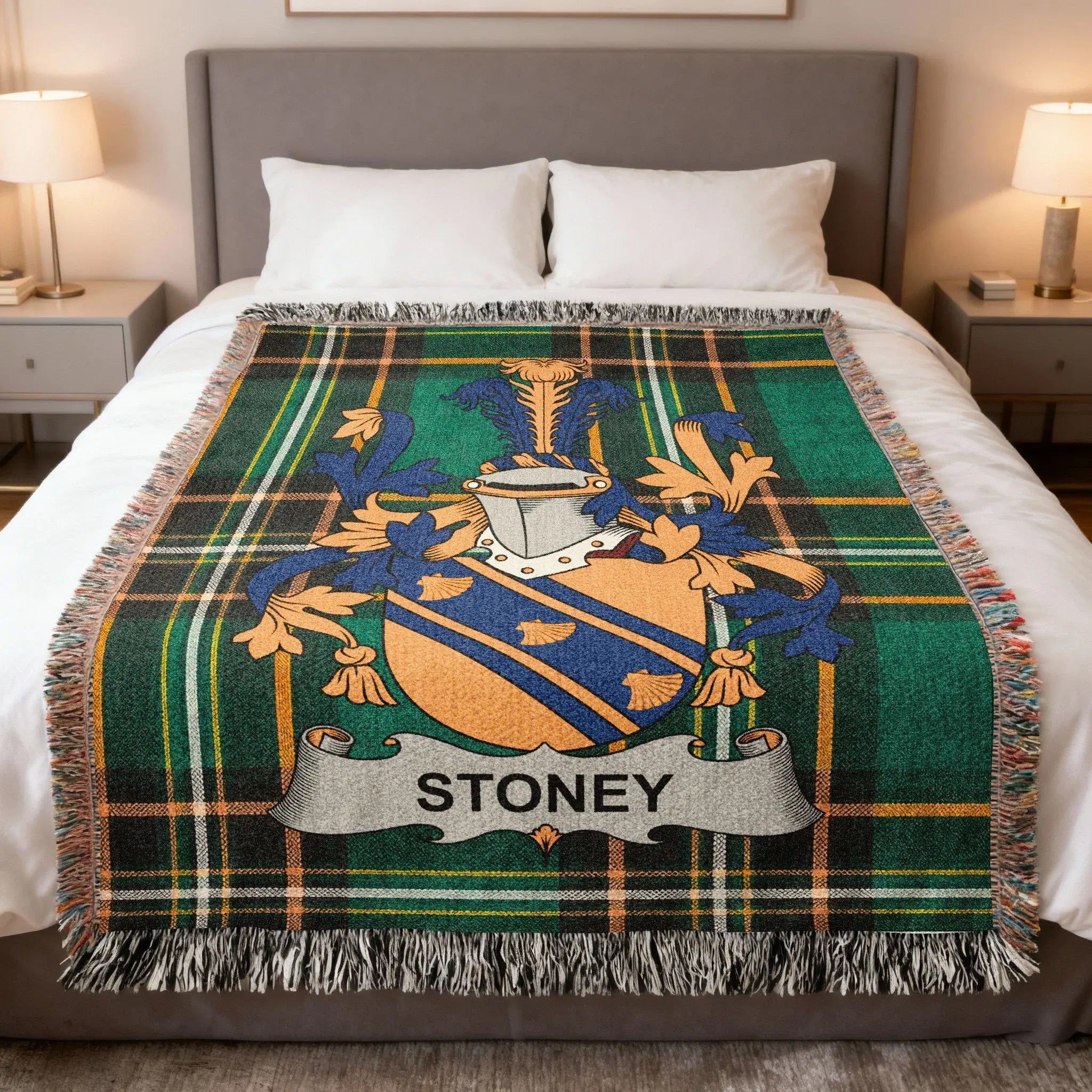Tartan blanket with Stoney coat of arms centered on bed.