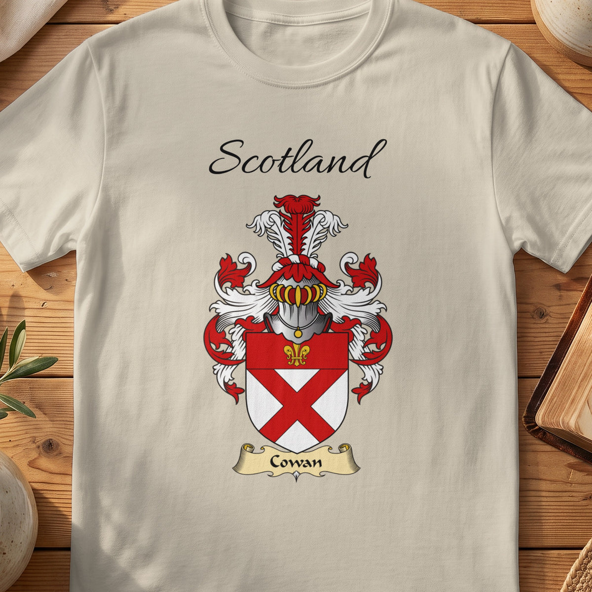 Sand Cowan Scottish family shield T-shirt featuring a red diagonal cross beneath a red top band