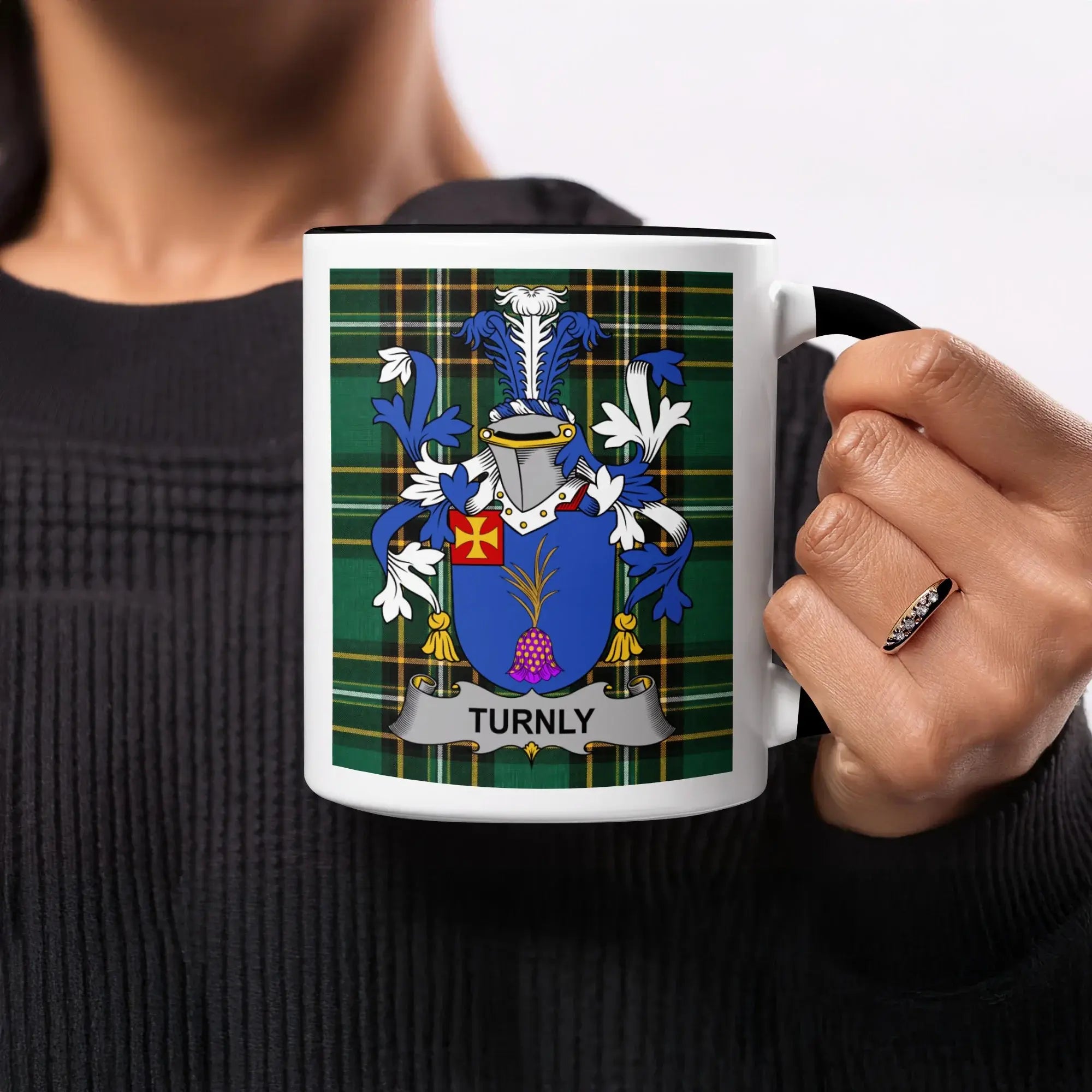 Mug featuring the Turnly family crest on a tartan background.