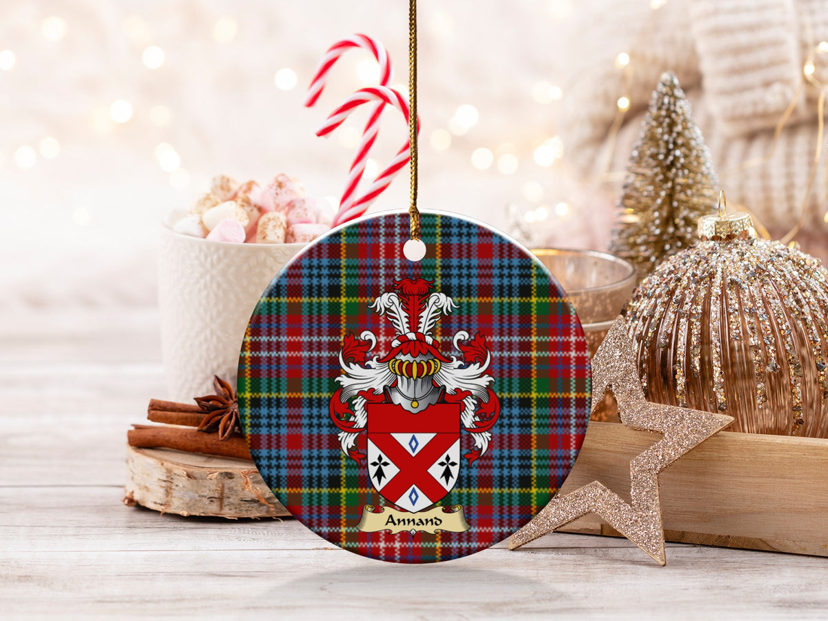 Annand family emblem ceramic Christmas ornament with Caledonia tartan background in festive holiday décor