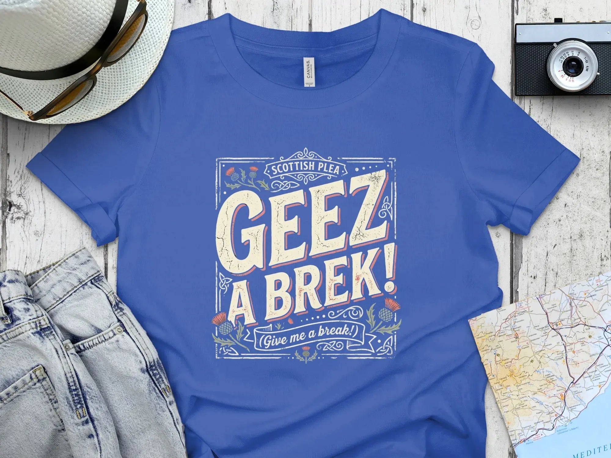 Blue t-shirt with "GEEZ A BREK!" in distressed white and yellow text.
