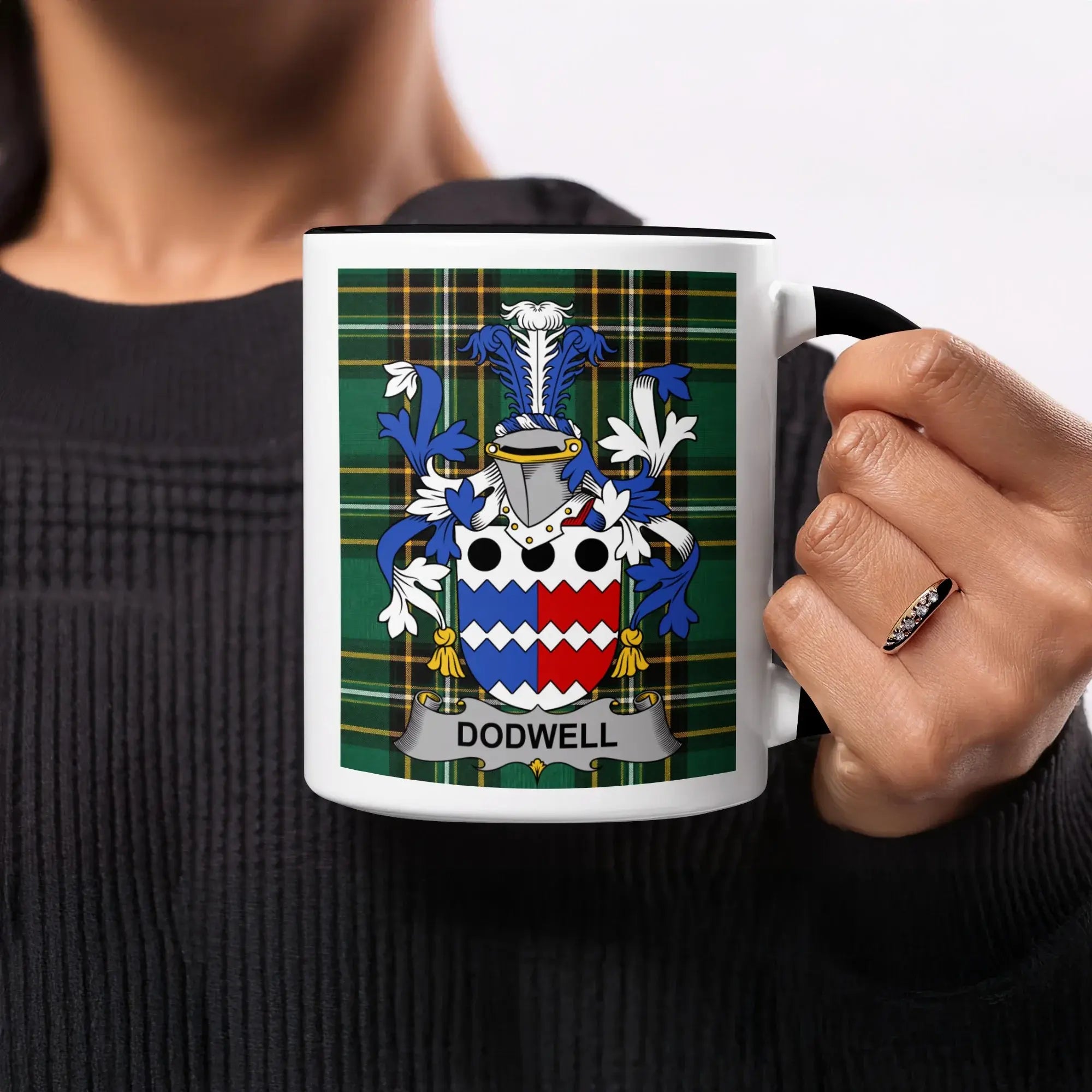 White mug with black rim, displaying a family crest with the name DODWELL.