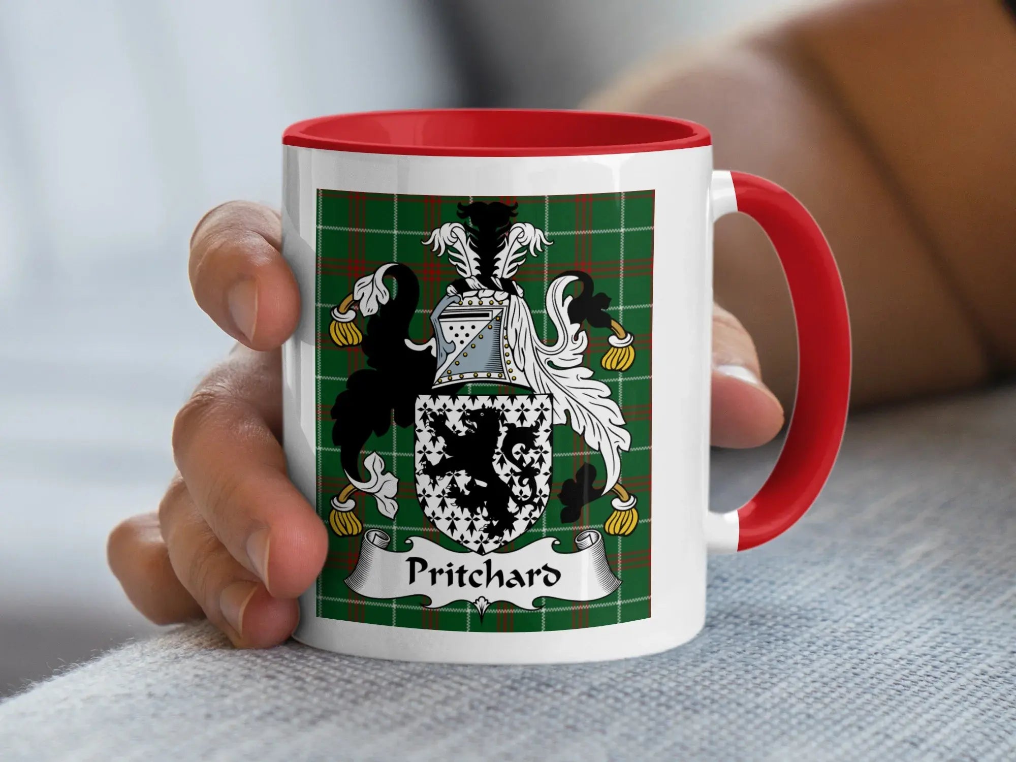 Pritchard Welsh tartan accent mug with red handle held in hand