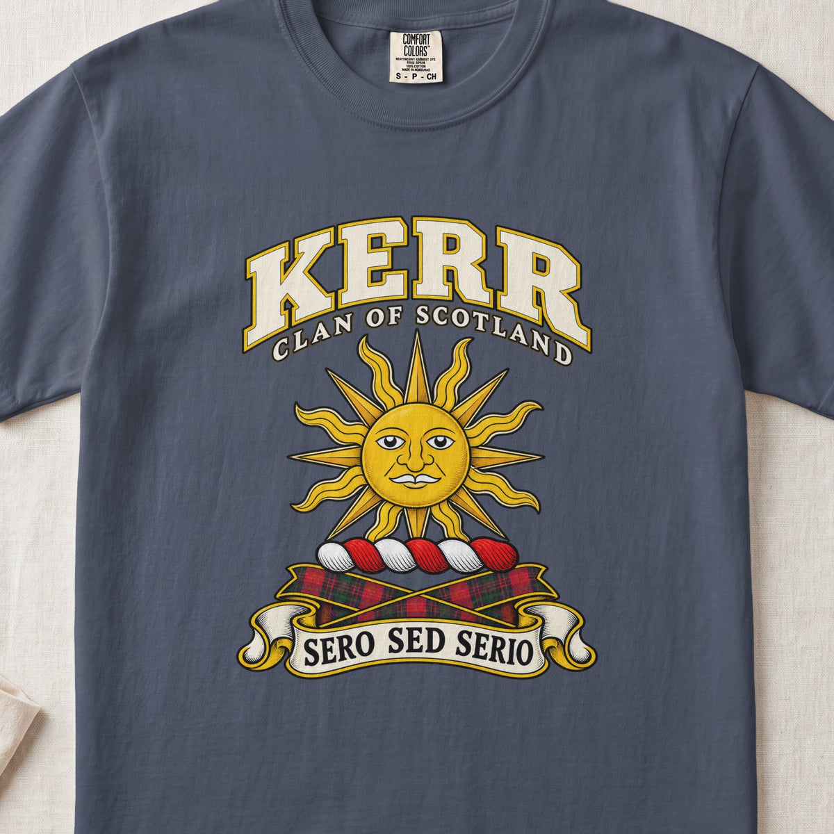 Kerr Scottish clan T-shirt in Midnight, front view with a golden sun with a face and motto banner.
