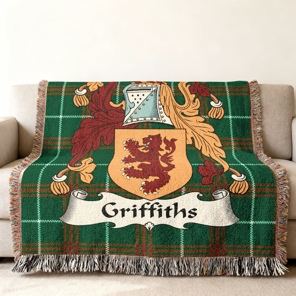 Griffiths family crest on a green plaid woven blanket with fringe.