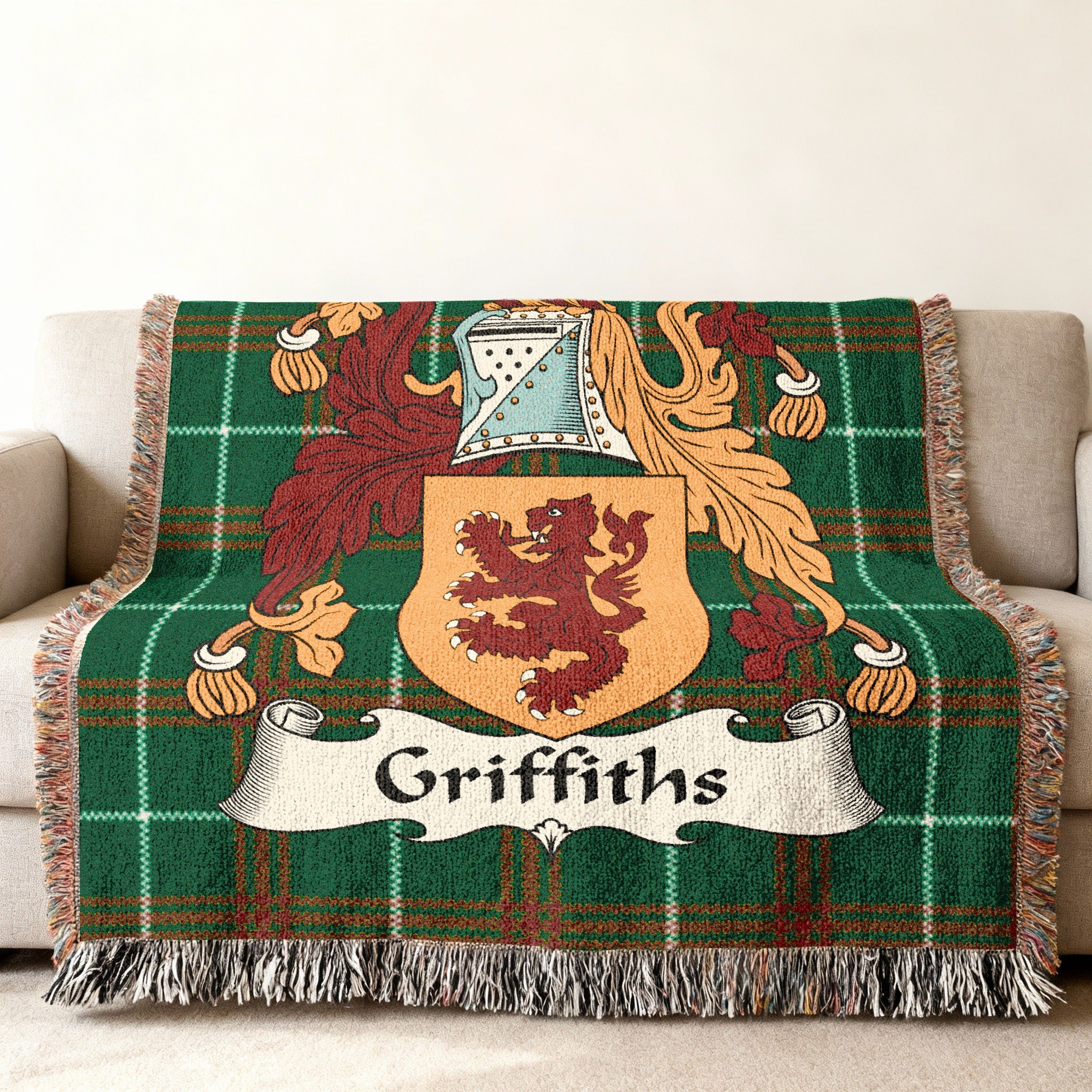 Griffiths family crest on a green plaid woven blanket with fringe.