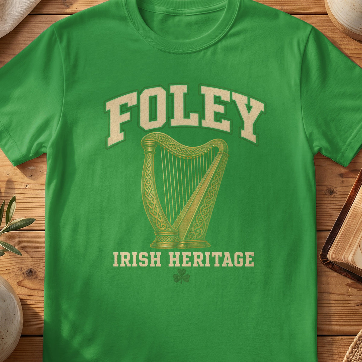 Foley Irish harp T-shirt in Irish Green, with cream surname lettering, a gold-toned harp, green shamrock and “Irish Heritage” text.