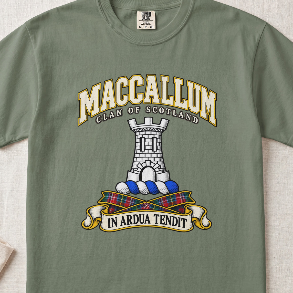 MacCallum Scottish clan T-shirt in Moss, front view with a silver stone tower and motto design.