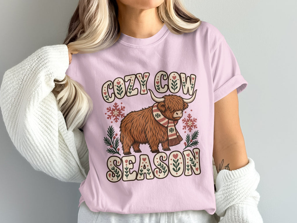 Model wearing the Cozy Cow Season Highland cow Comfort Colors T-shirt in Blossom