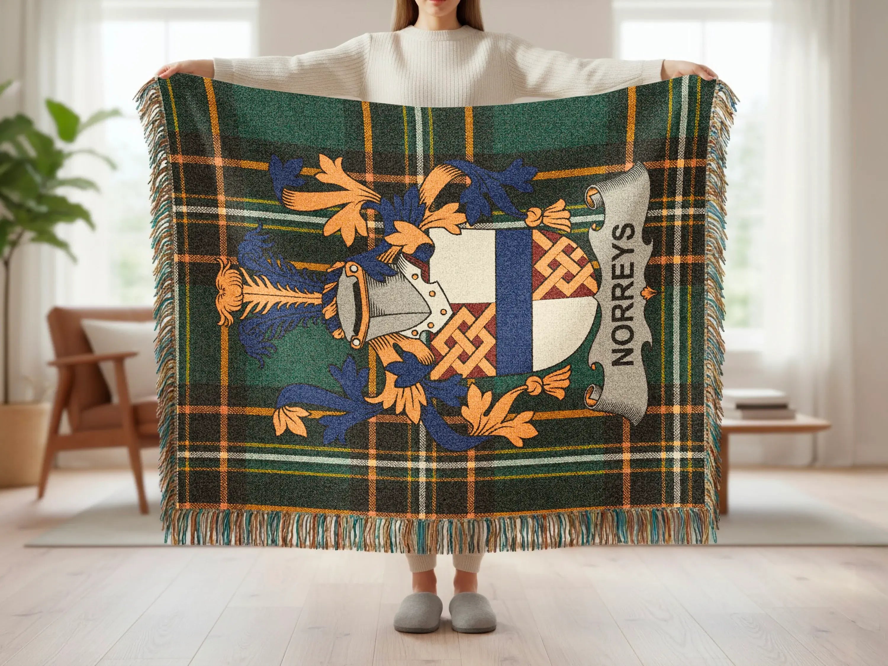 Tartan blanket with crest featuring "NORREYS" in a banner.