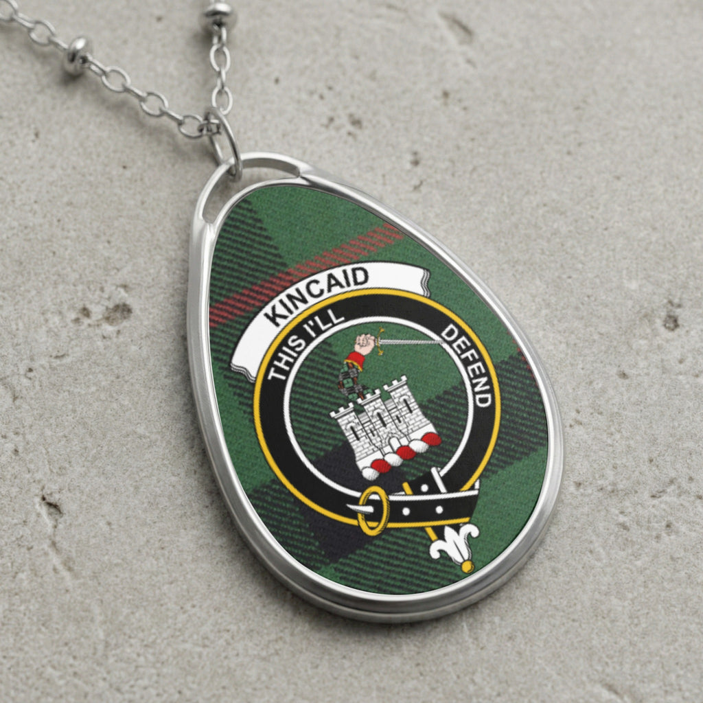 Kincaid clan Scottish tartan necklace with clan crest and This I'll Defend motto on tartan background