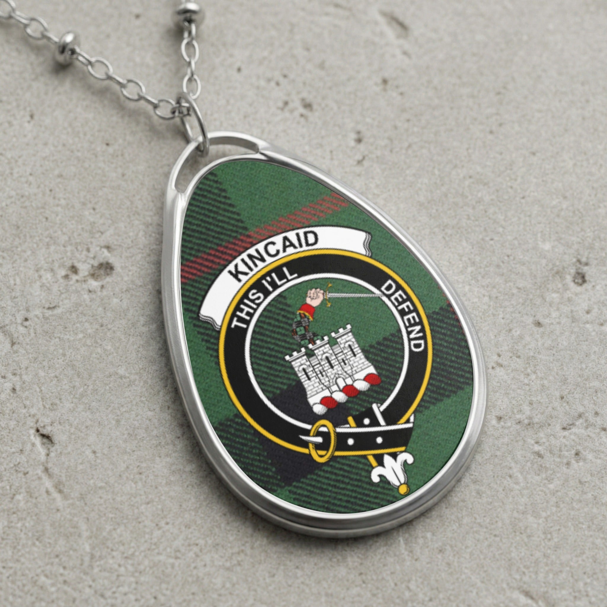 Kincaid clan Scottish tartan necklace with clan crest and This I'll Defend motto on tartan background