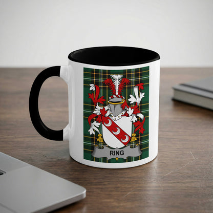 White mug with black rim displaying a family crest with the name "Ring".
