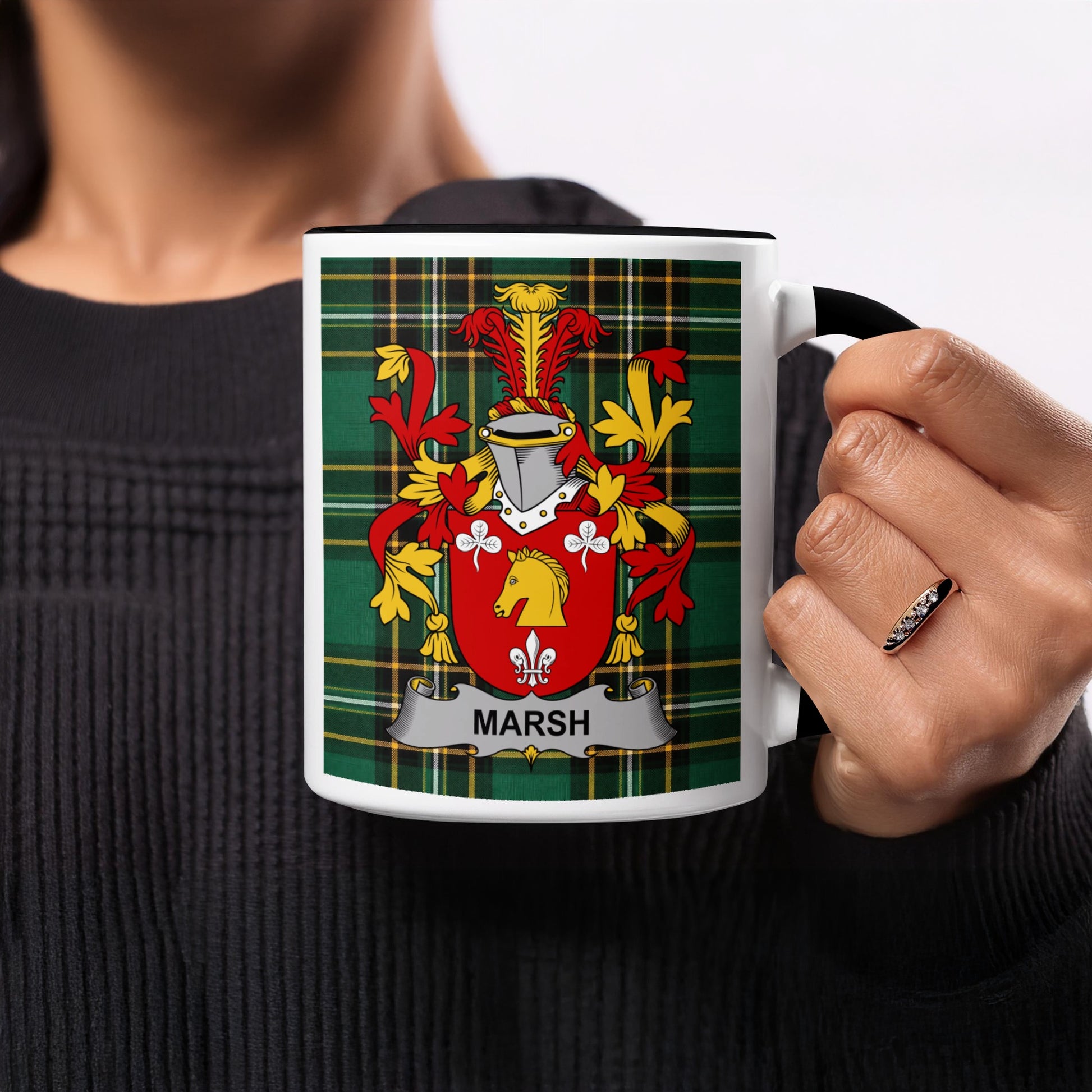 White mug with black handle featuring Marsh family crest on green tartan background.