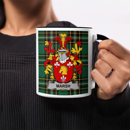 White mug with black handle featuring Marsh family crest on green tartan background.
