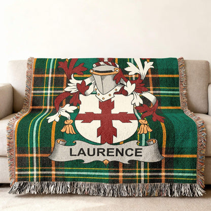 Laurence family crest on green tartan blanket with fringe.