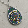 Macorquodale clan Scottish tartan necklace with clan crest and Vivat Rex motto on tartan background