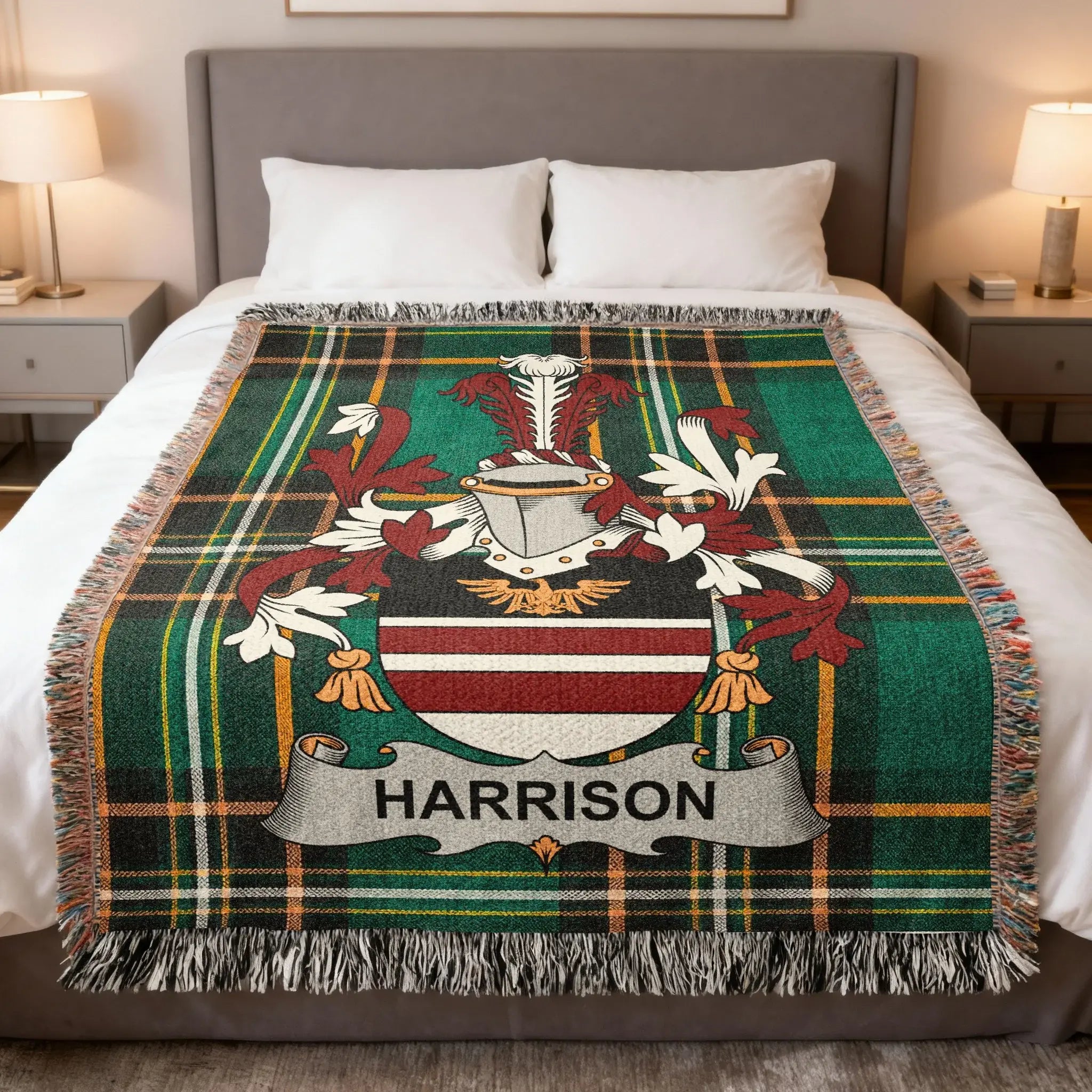 Harrison family crest on a green tartan plaid blanket with fringe.