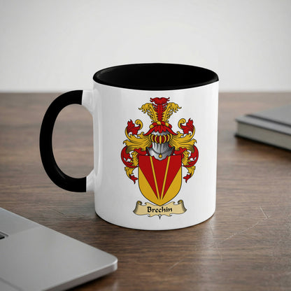 White mug with black rim, featuring a red and gold crest with the name "Brechin".