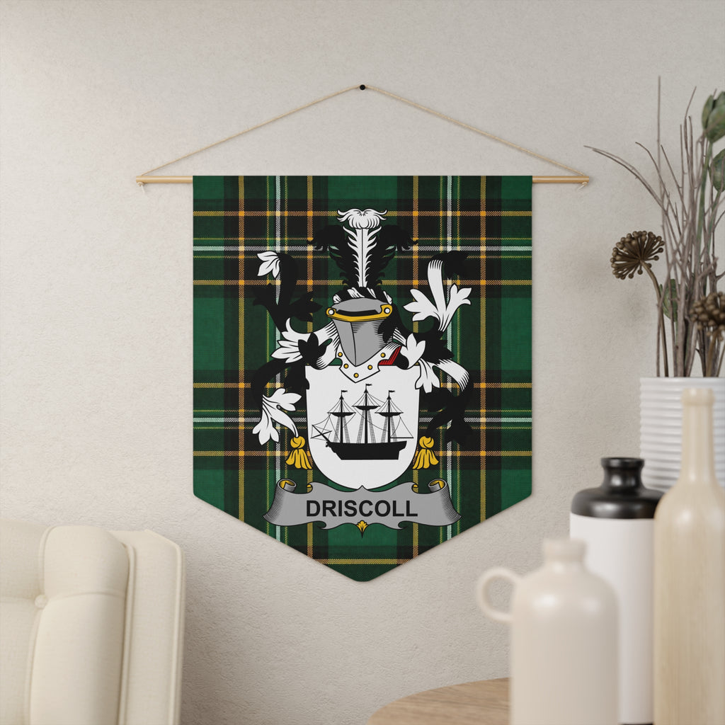 Driscoll family crest on a green tartan banner hanging on a wall.