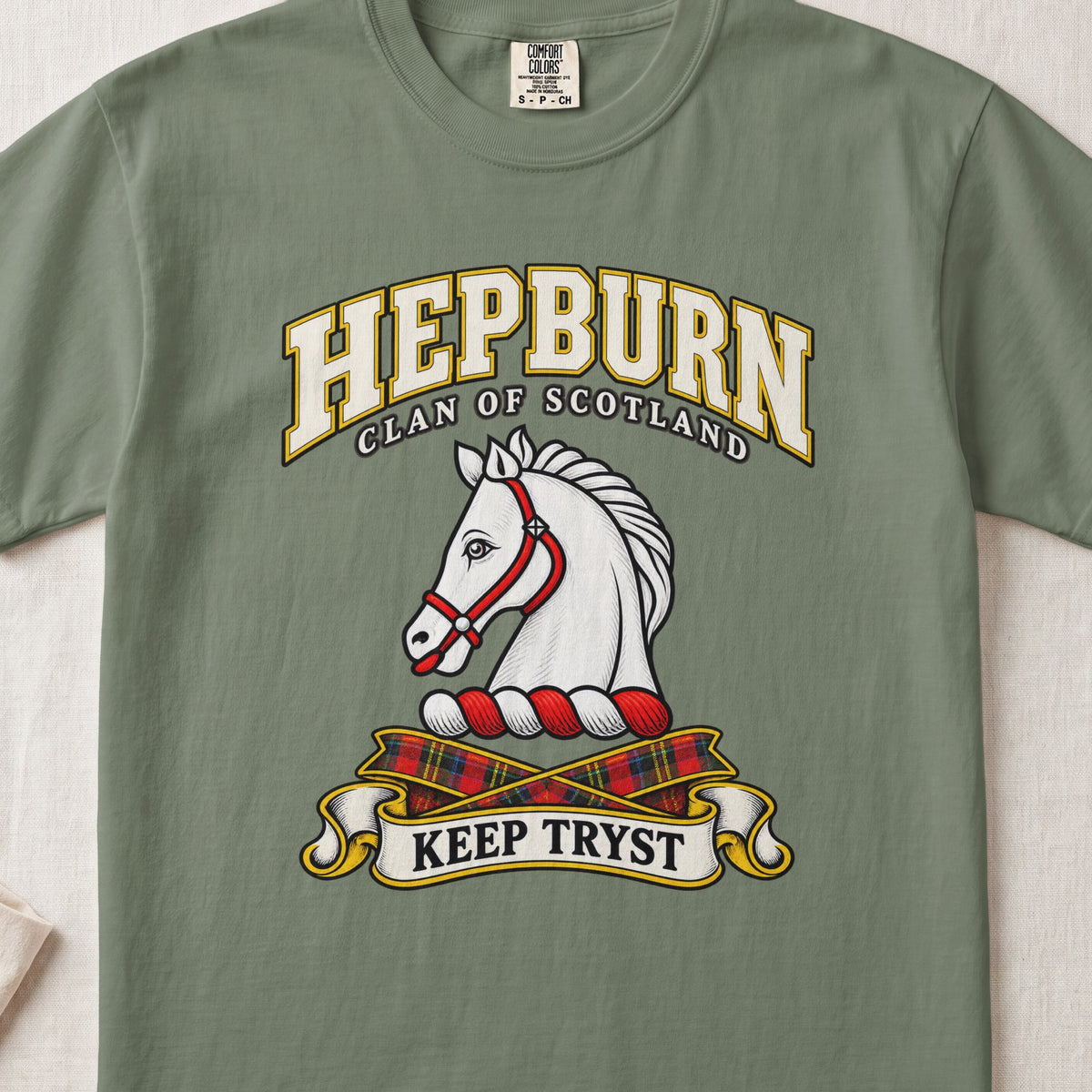 Hepburn Scottish clan T-shirt in Moss, front view with a white horse head with a red bridle and motto banner.