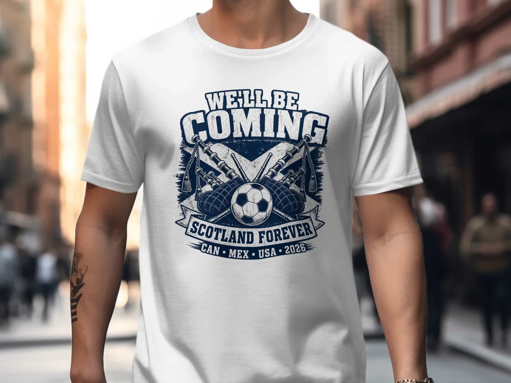 T-shirt with Scotland, bagpipes, soccer ball, and text "WE'LL BE COMING".