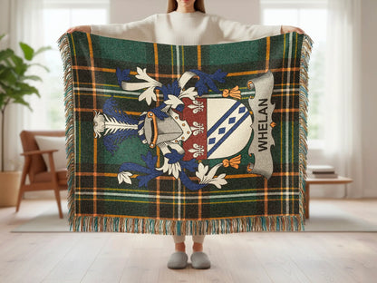 Tartan blanket with Whelan family crest held by person.