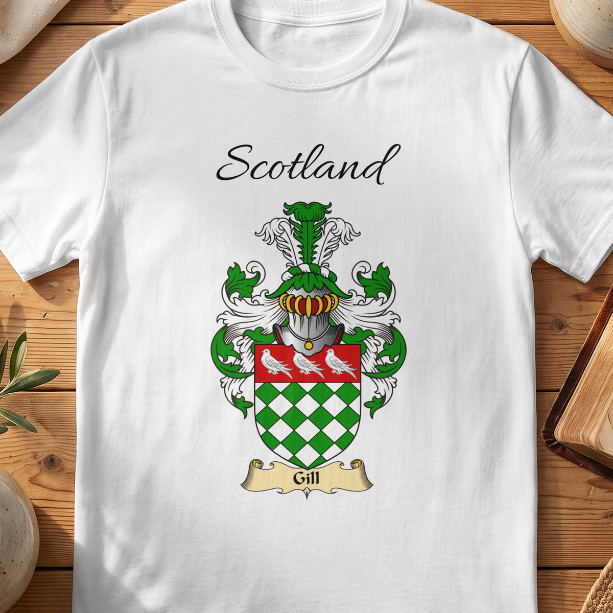 White Gill Scottish family shield T-shirt featuring green-and-white diamonds beneath white birds
