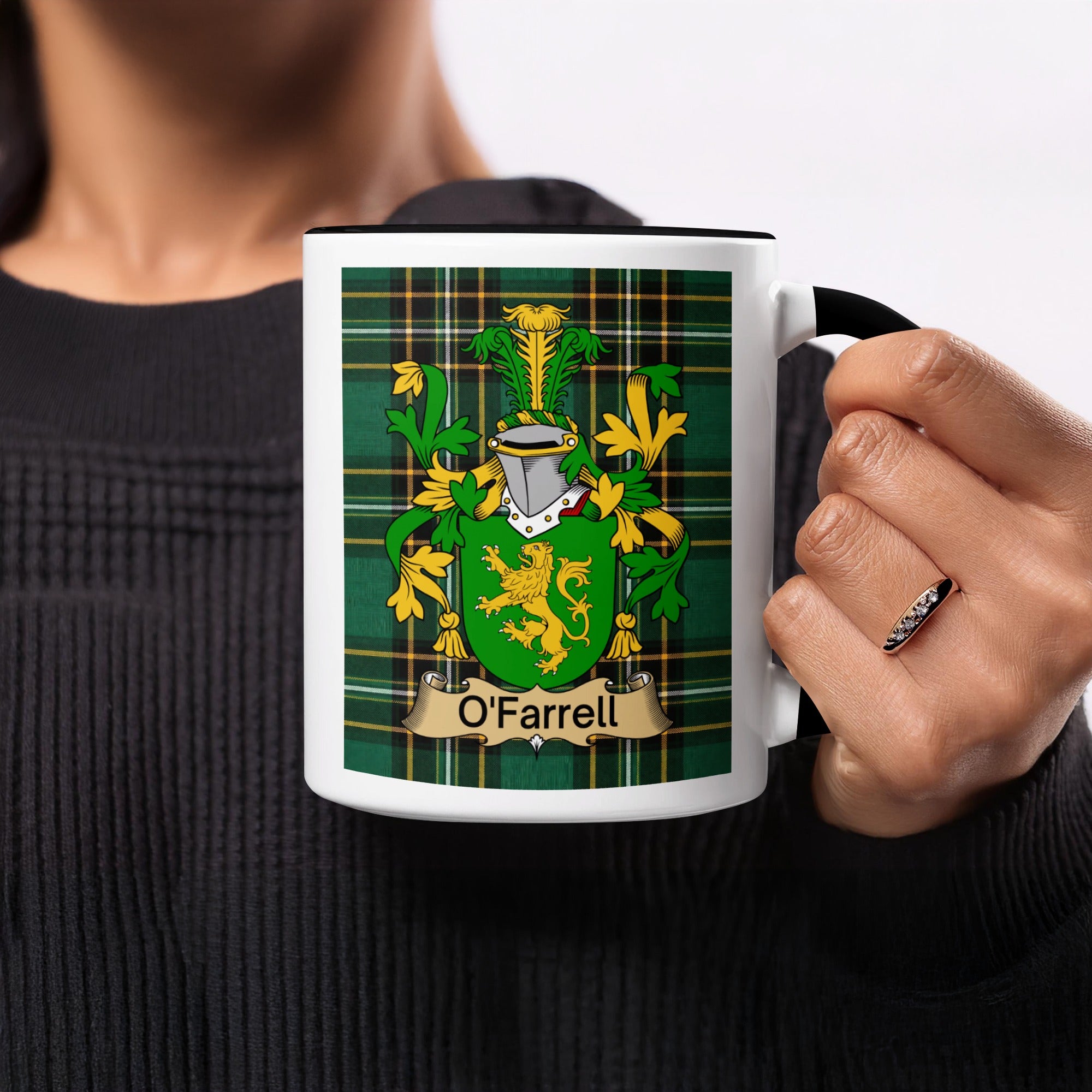 O'Farrell Irish family crest mug on Irish National Tartan background held in hand
