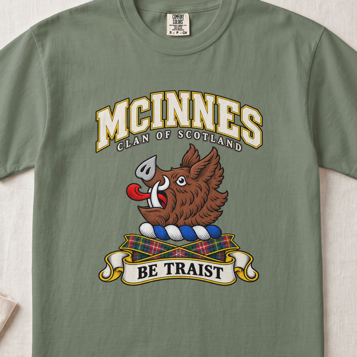 McInnes Scottish clan T-shirt in Moss, front view with a brown boar head and motto design.