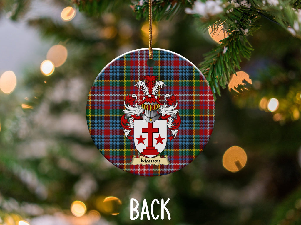 Manson ceramic ornament detail showing a double-sided family shield on a Caledonia tartan background