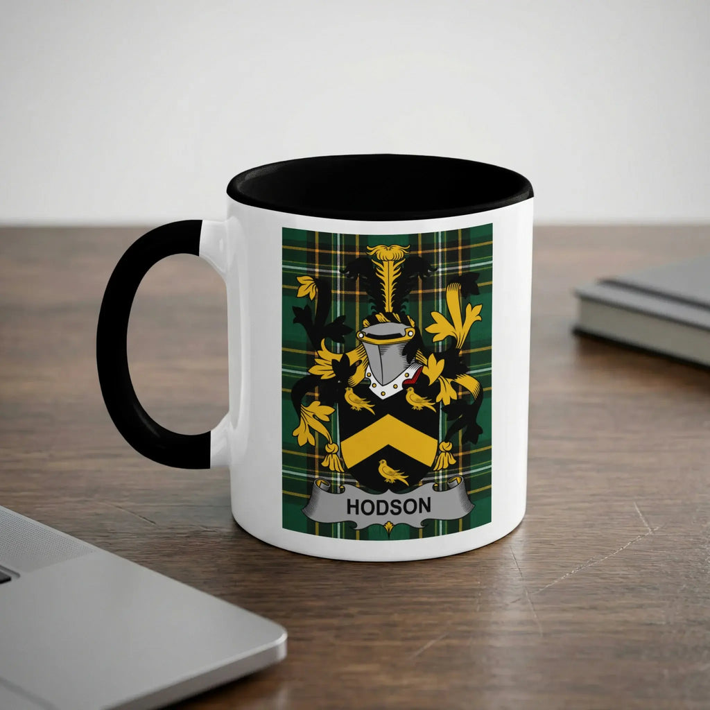 White mug with black handle featuring the Hodson family crest on a checkered background.