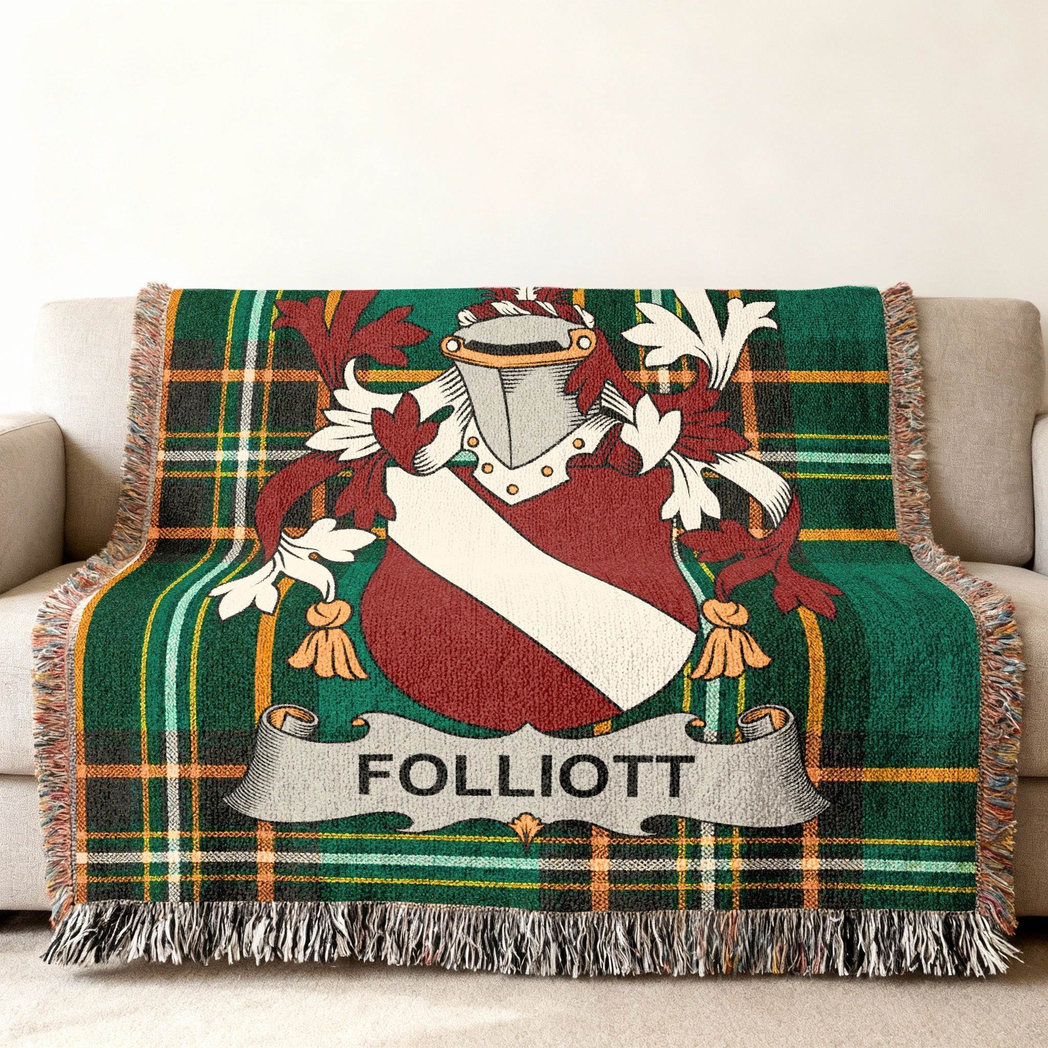 Woven blanket with green tartan pattern and Folliott family crest.