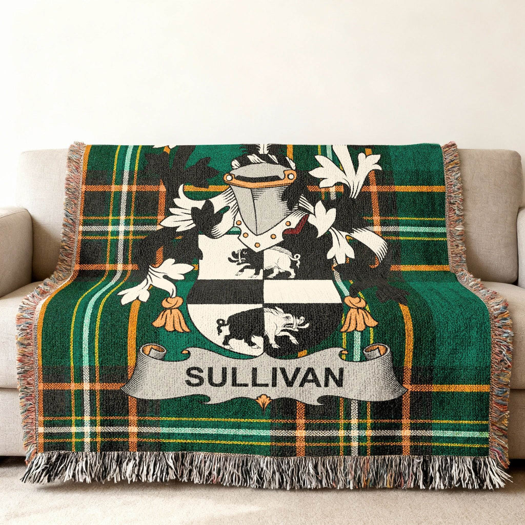 Green plaid throw blanket with Sullivan family crest displayed prominently.