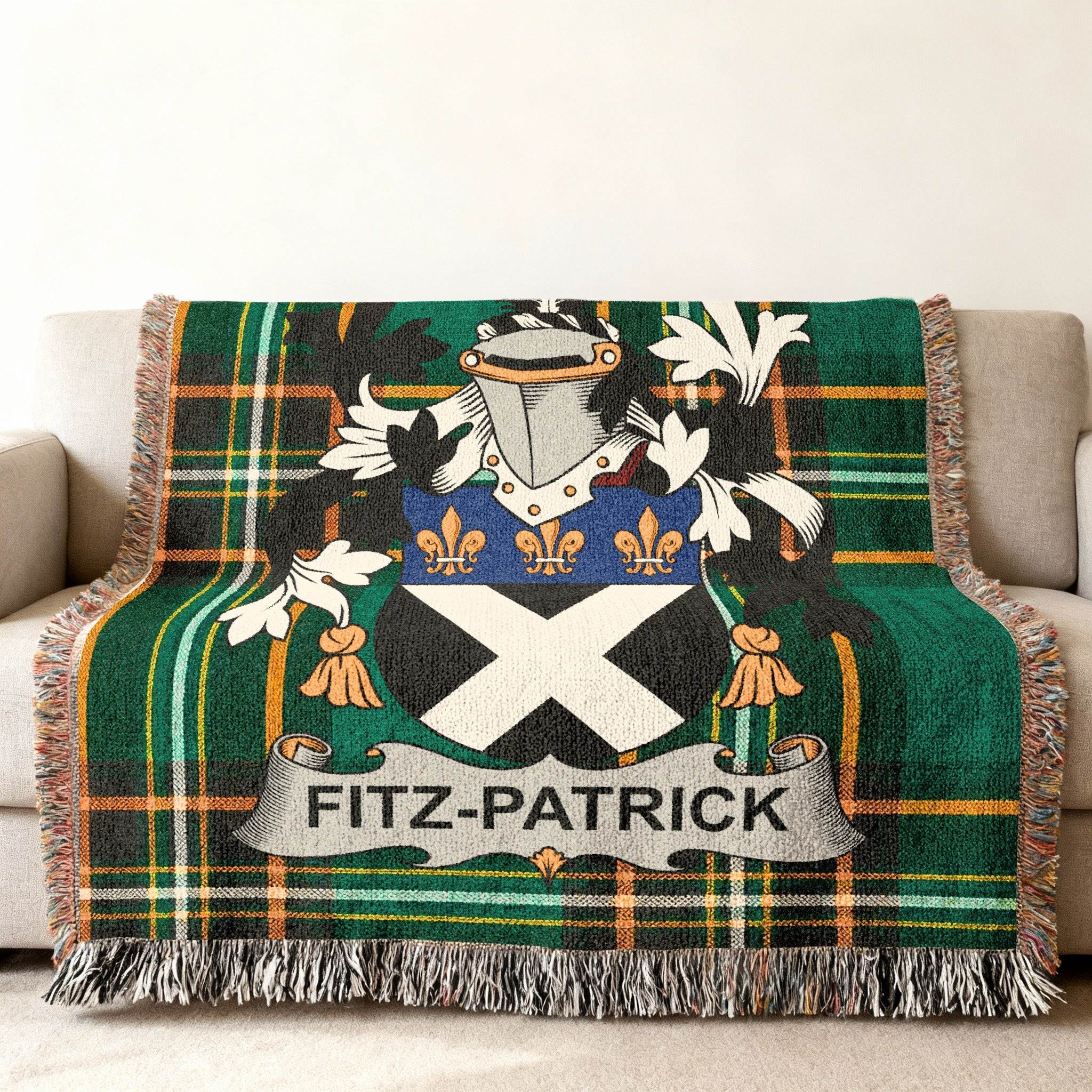 Fitz-Patrick family crest on a green and black tartan throw blanket.